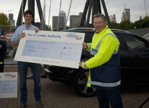 PLA Chairman Simon Sherrard presents a cheque to the Watersports Centre