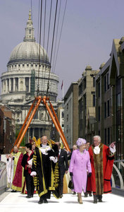 The Queen walks on the Millennium Bridge in London, as she talks to the Mayor of Southwark Charles Cherrill. The Queen is on the pedestrian bridge over the Thames, to officially open the link between the north at St. Paul's to the new Tate Modern gallery 