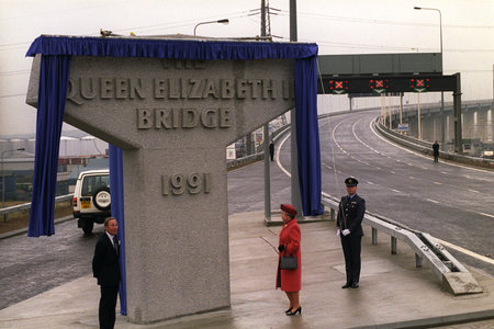 The Queen unveils the monument stone, naming the new road bridge over the River Thames at Dartford, Kent. On the left is Lord Rockley. (AP Photo by kind permission of the Press Association)