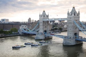 Cory Environmental's four new tugs pass under Tower Bridge