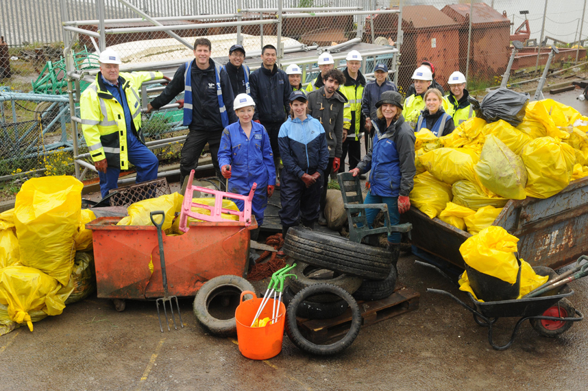 PLA and Thames21 clean up team with the tyres, chair, wheelie bin and bags of rubbish cleared from the foreshore